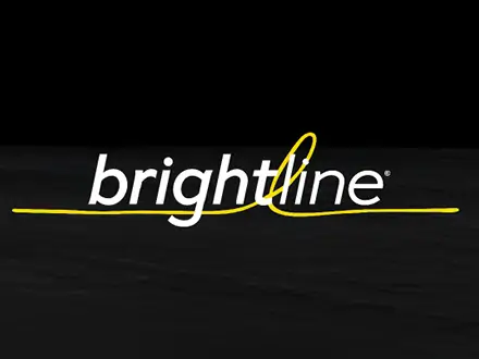 Two logos on a dark background: “McLaren Applied” in white on the left and “brightline” in white lowercase letters with a yellow underline and loop on the right, separated by a thin vertical line. An Active Antenna unit is partially visible in the top left corner.