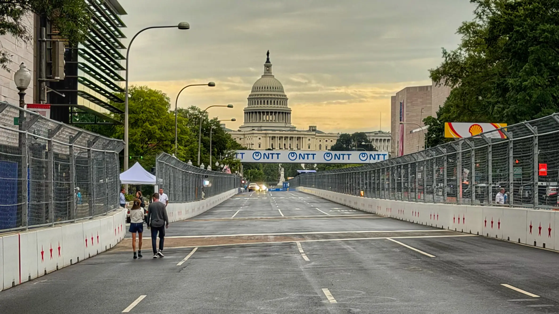 Race track at sunset with a grand white building in the background